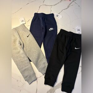 NWT 3 pairs of Kids Nike Sweatpants sz 4, black, gray, and navy